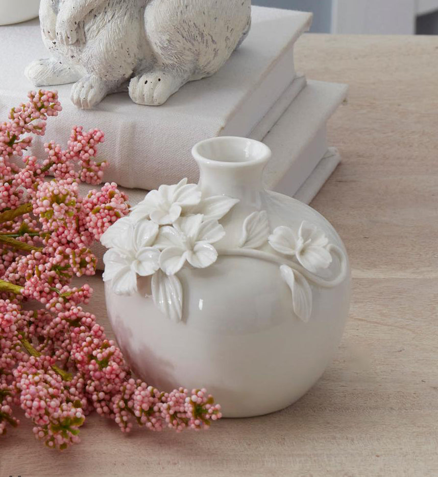 Floreros redondos de ceramica con flor resaltada