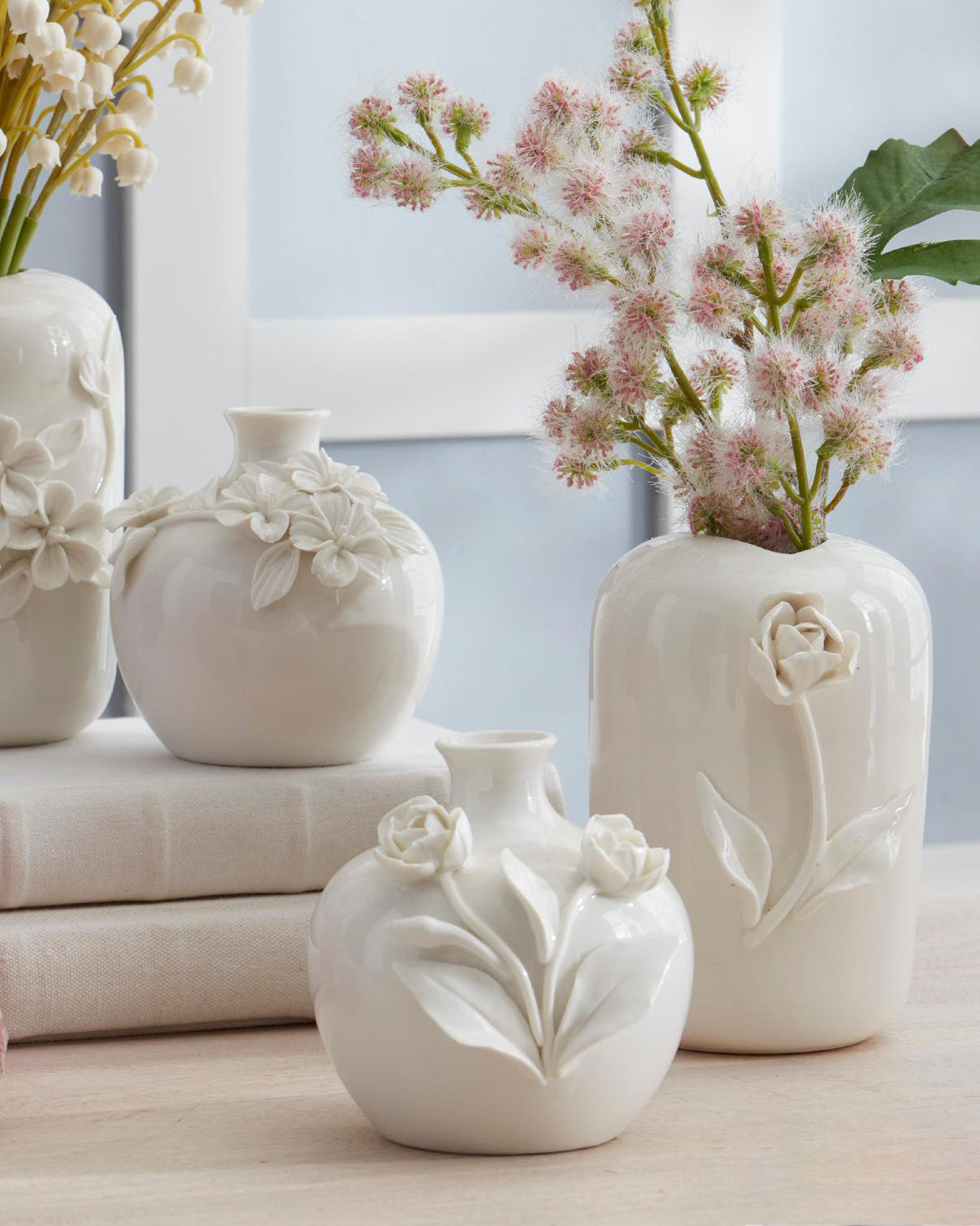 Floreros redondos de ceramica con flor resaltada