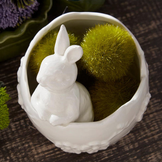 Maceta de huevo con relieve floral y un conejito