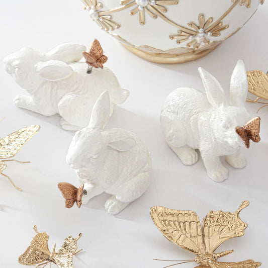 Conejitos con mariposas doradas